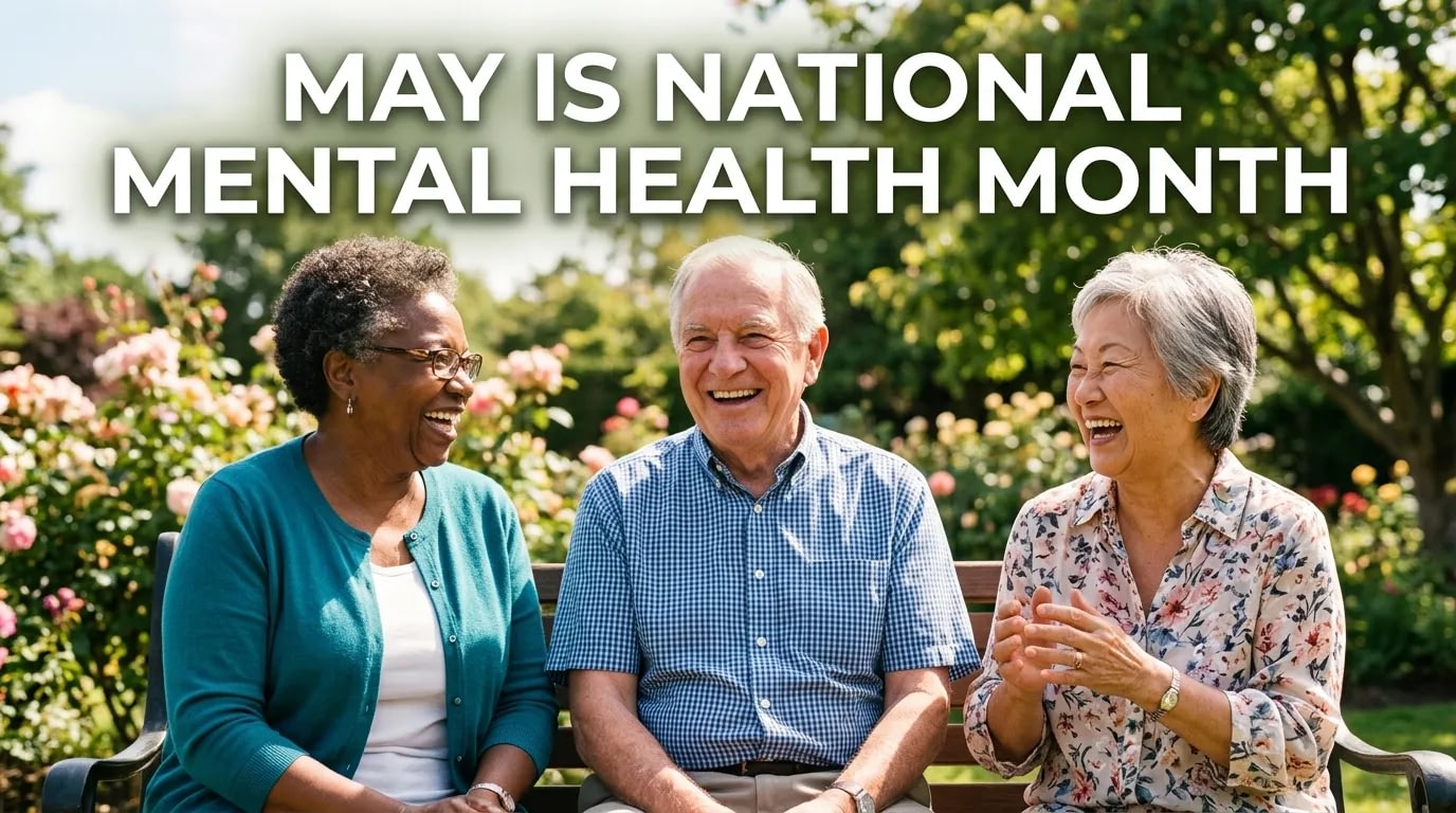 Three seniors laughing on park bench
