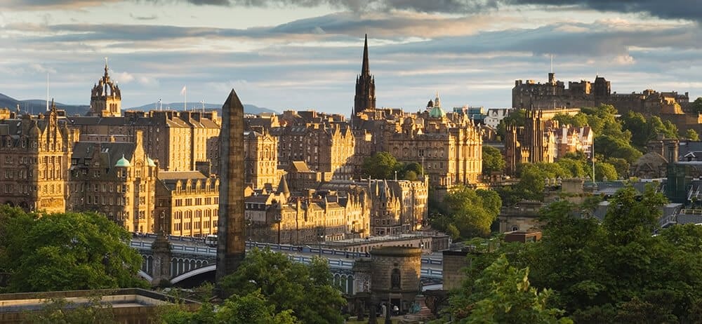 Edinburgh skyline at sunset with castle and monument