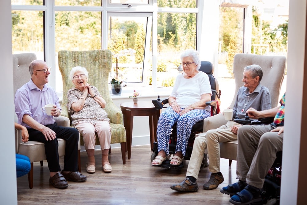 Seniors chatting in bright community room