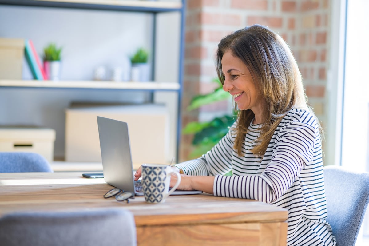 Woman working on laptop at home office