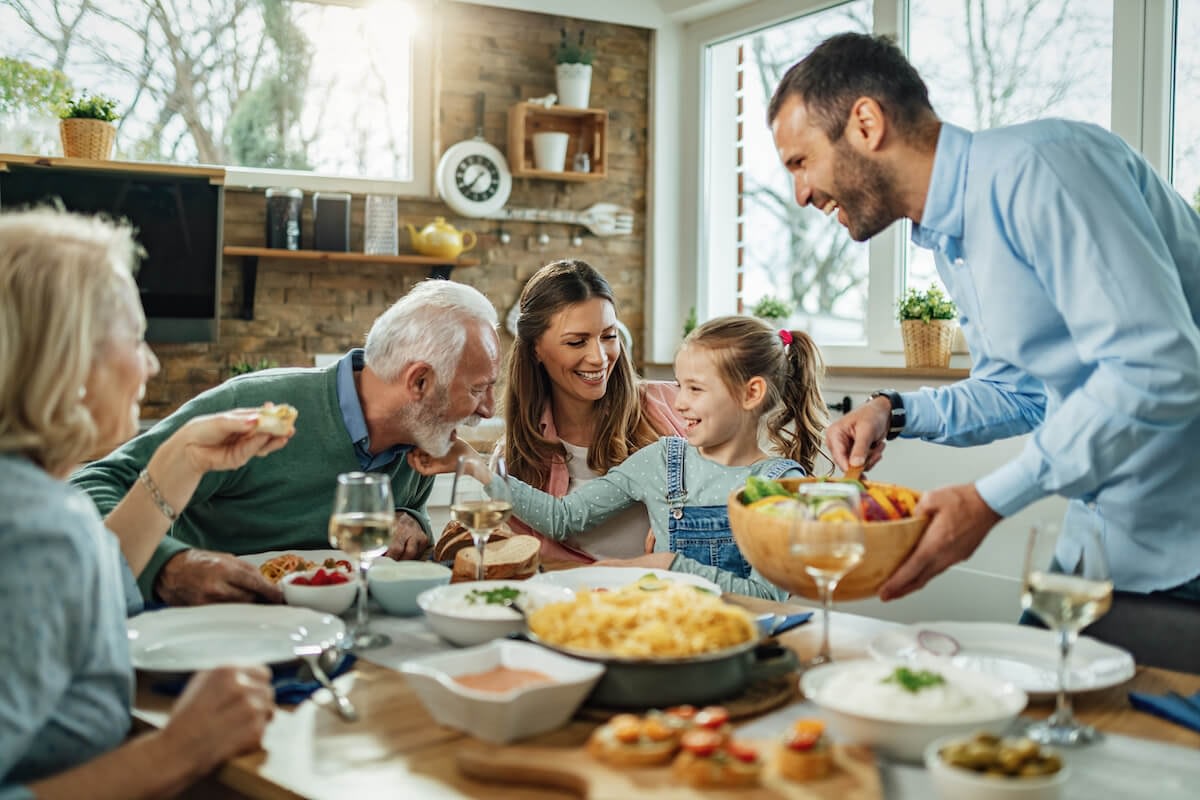 Multigenerational family enjoying dinner together at home