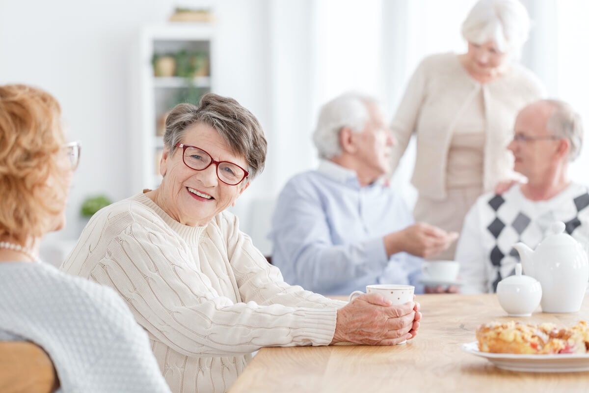 Seniors enjoying tea together at a table