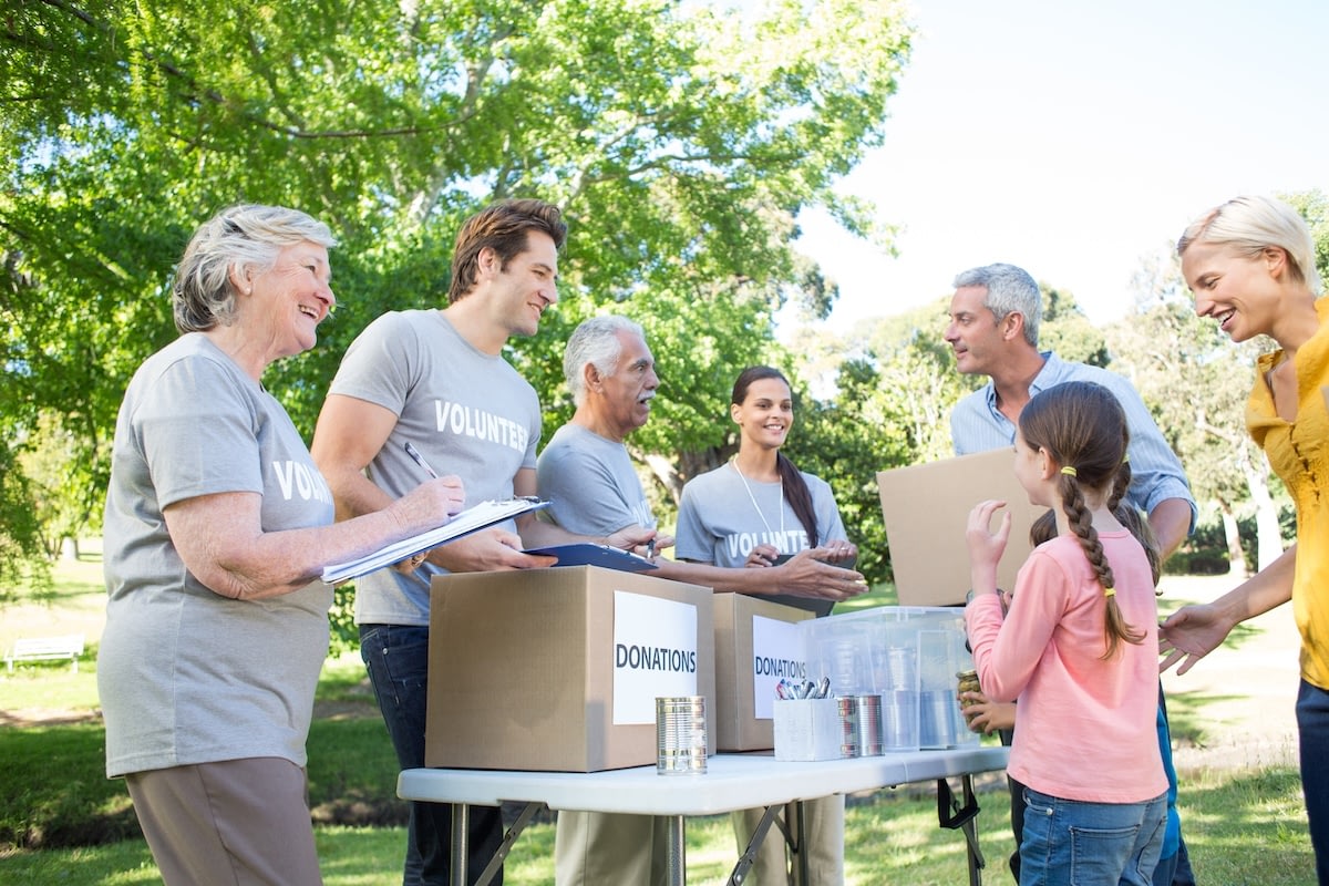 Volunteers collecting donations at park community event
