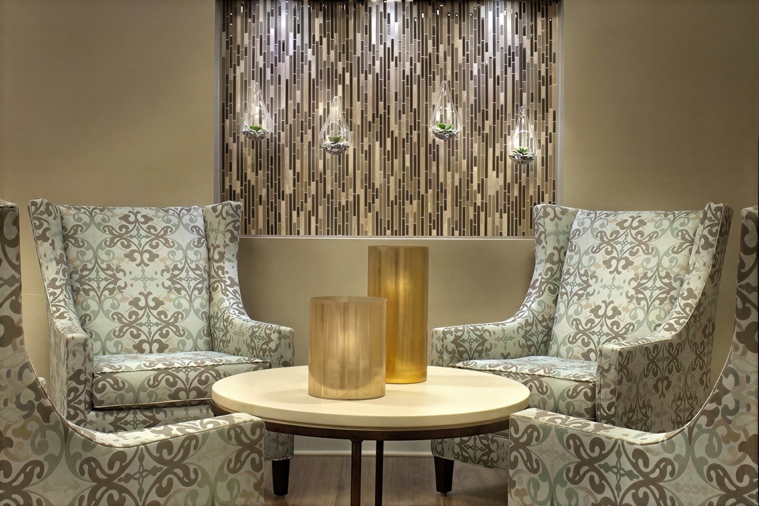 Modern lounge with patterned armchairs and round table