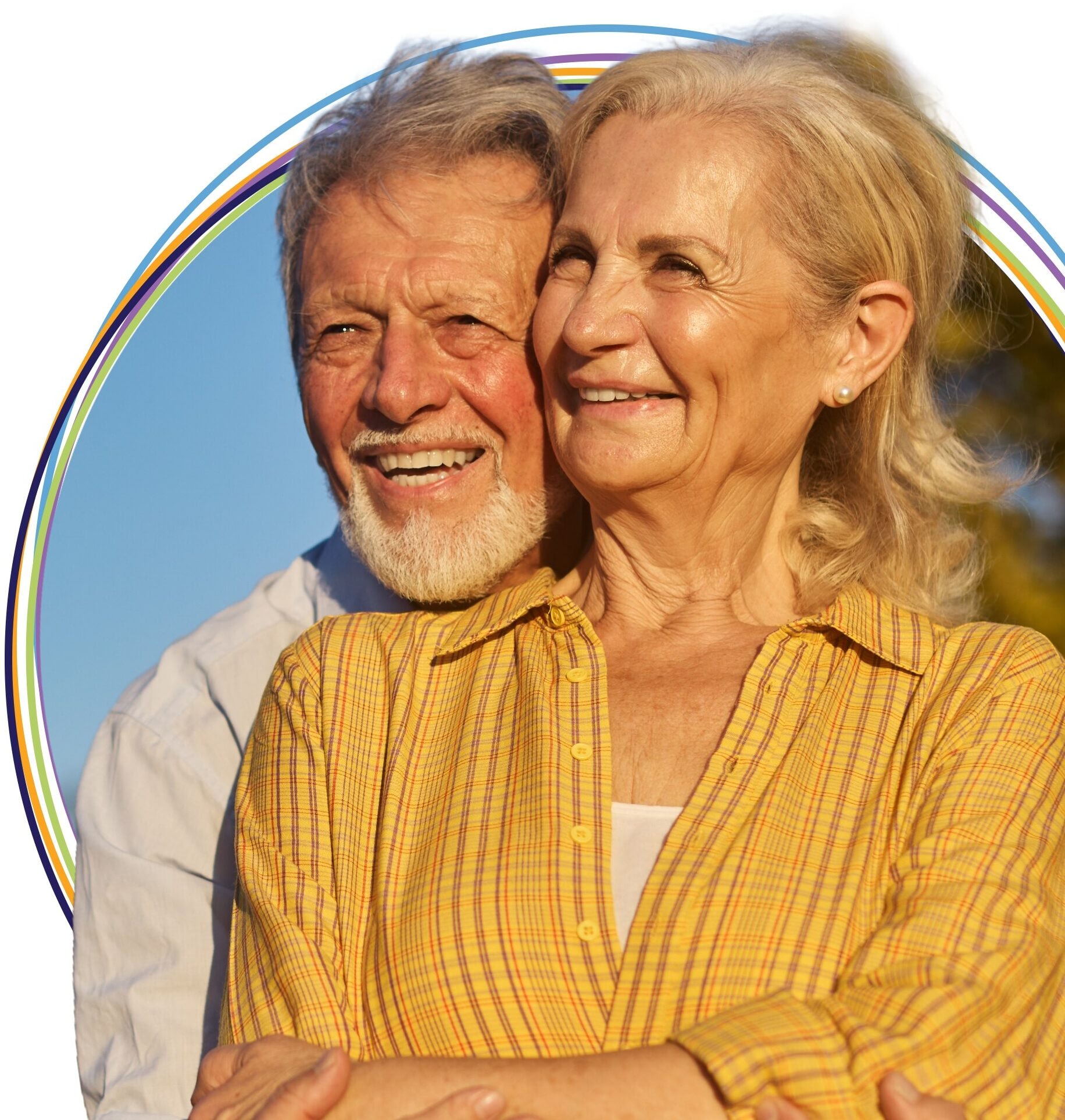 Smiling senior couple outdoors with rainbow graphic