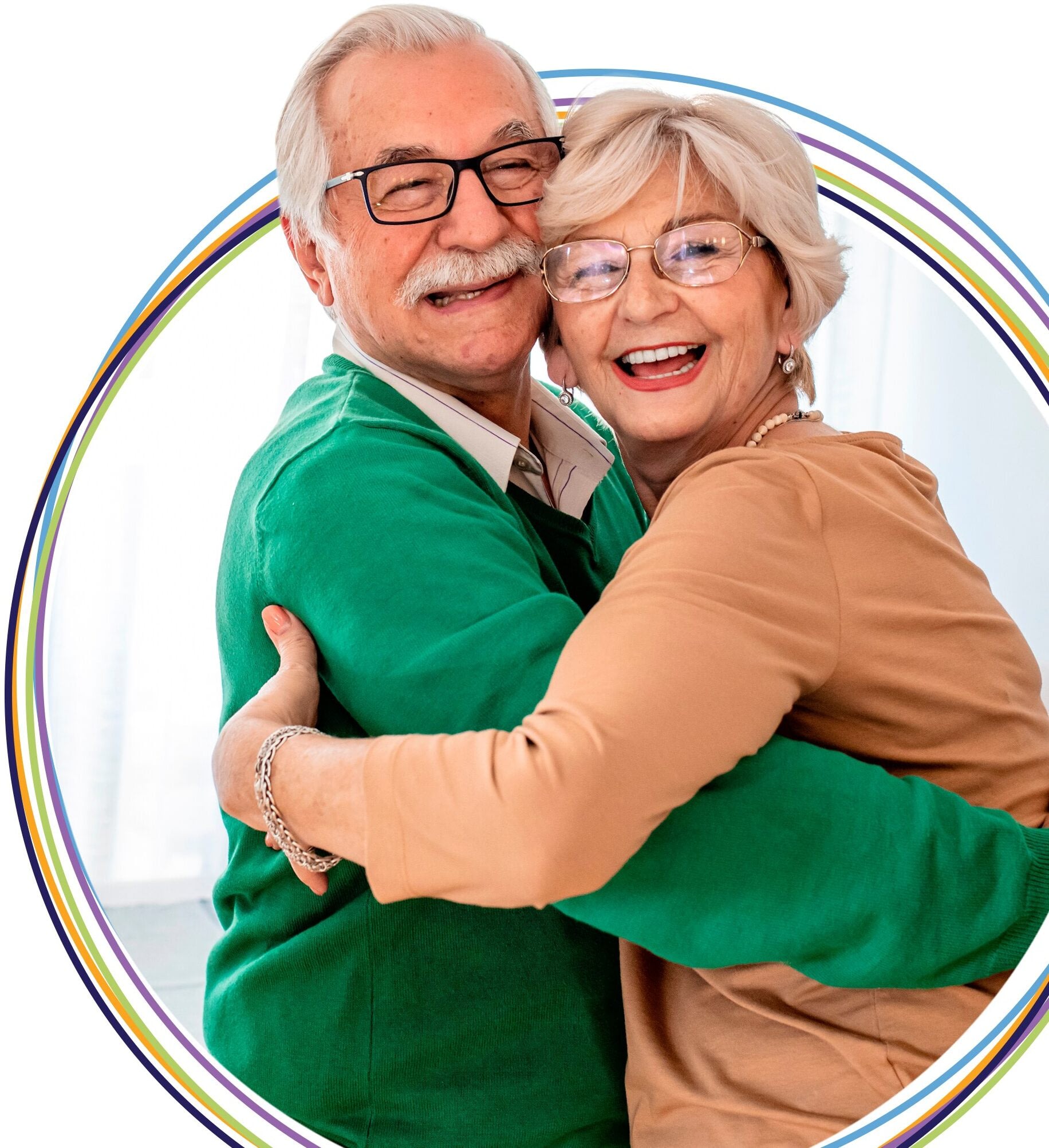Smiling elderly couple hugging with colorful background