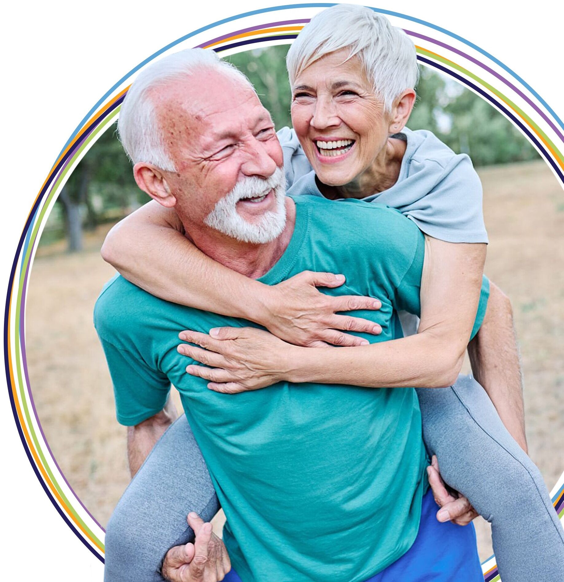 Happy senior couple embracing outdoors with rainbow border