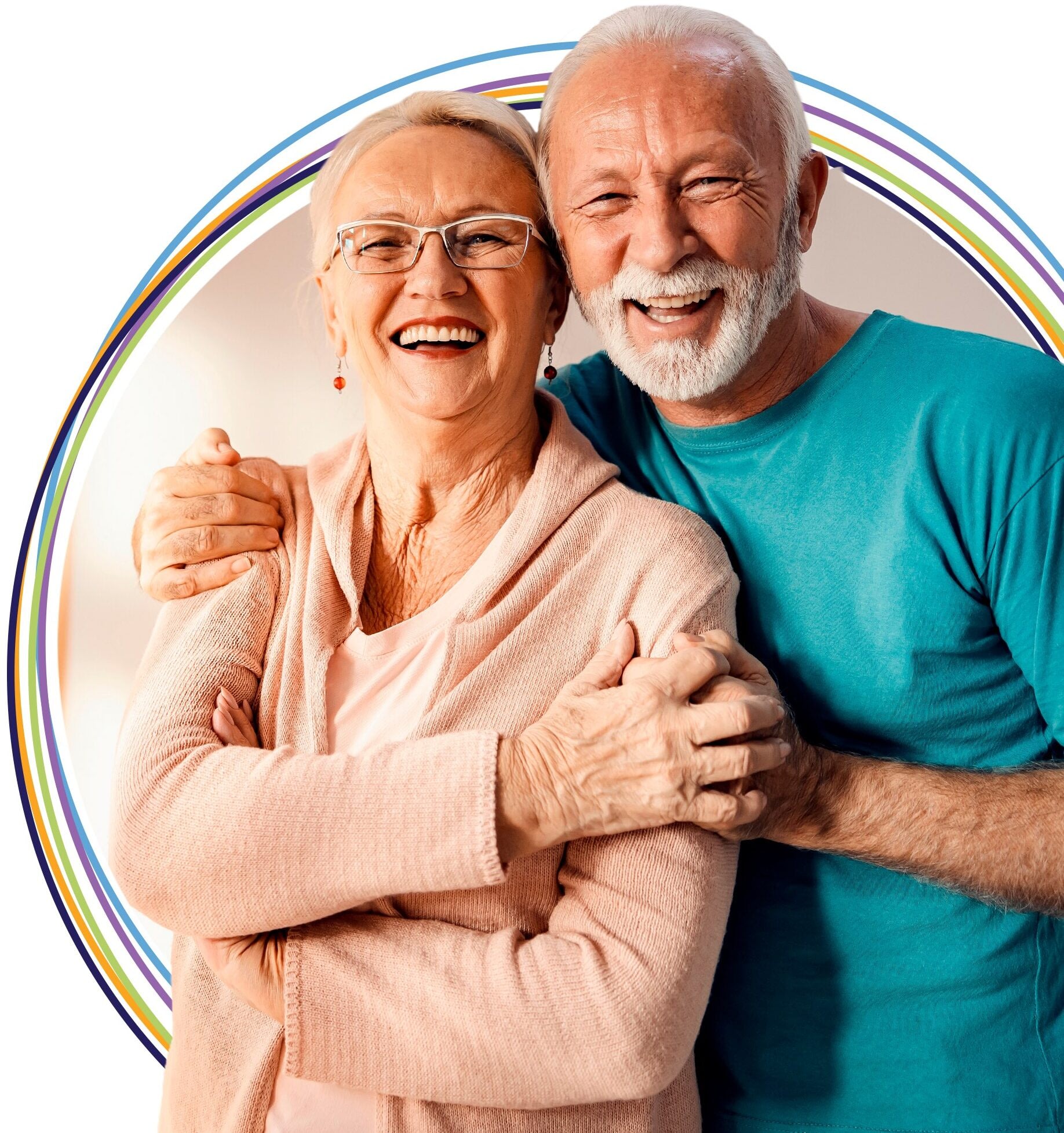 Smiling senior couple embracing with rainbow backdrop