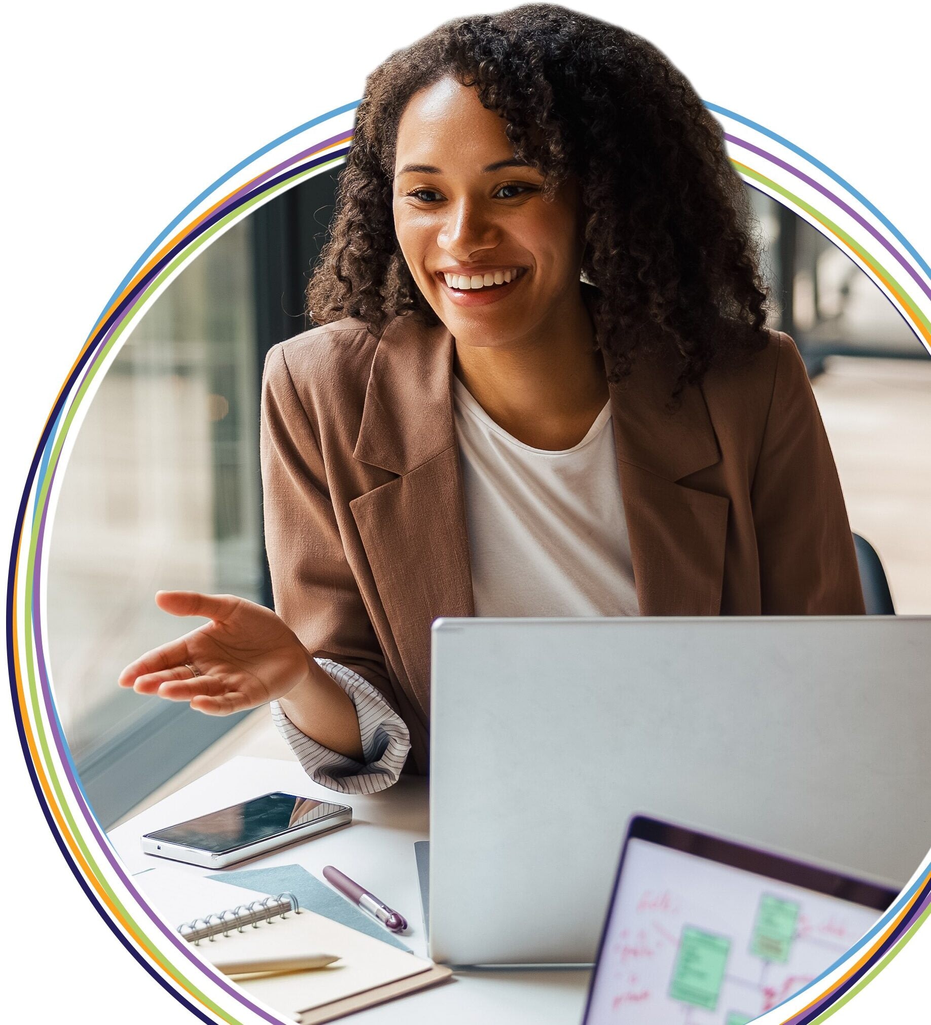 Smiling professional woman working at laptop desk