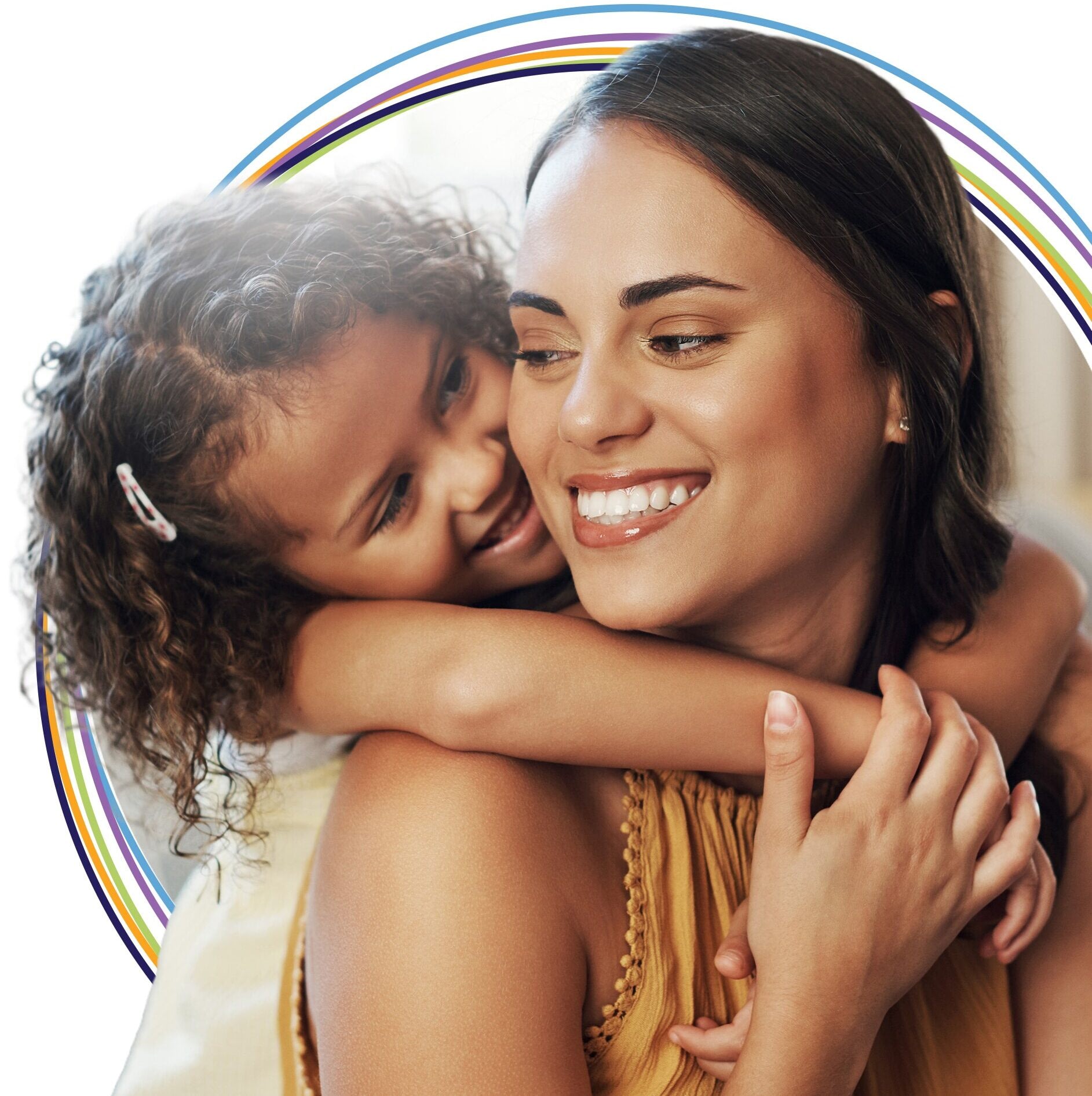 Smiling mother and daughter hugging with rainbow graphic