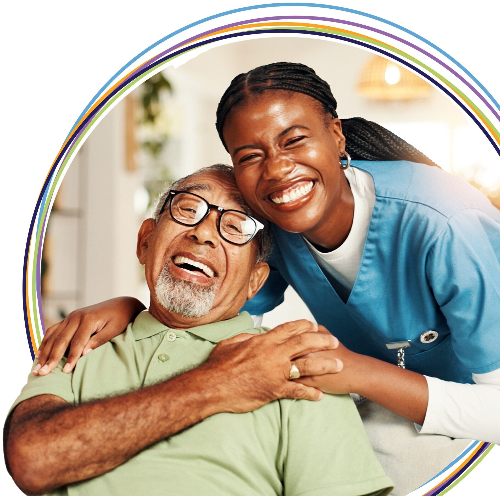 Smiling caregiver hugging elderly man indoors
