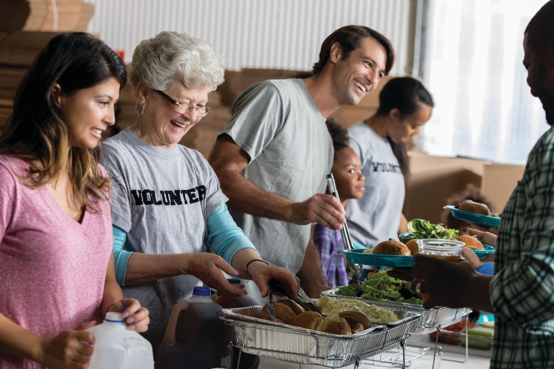 Volunteers serving food at community kitchen
