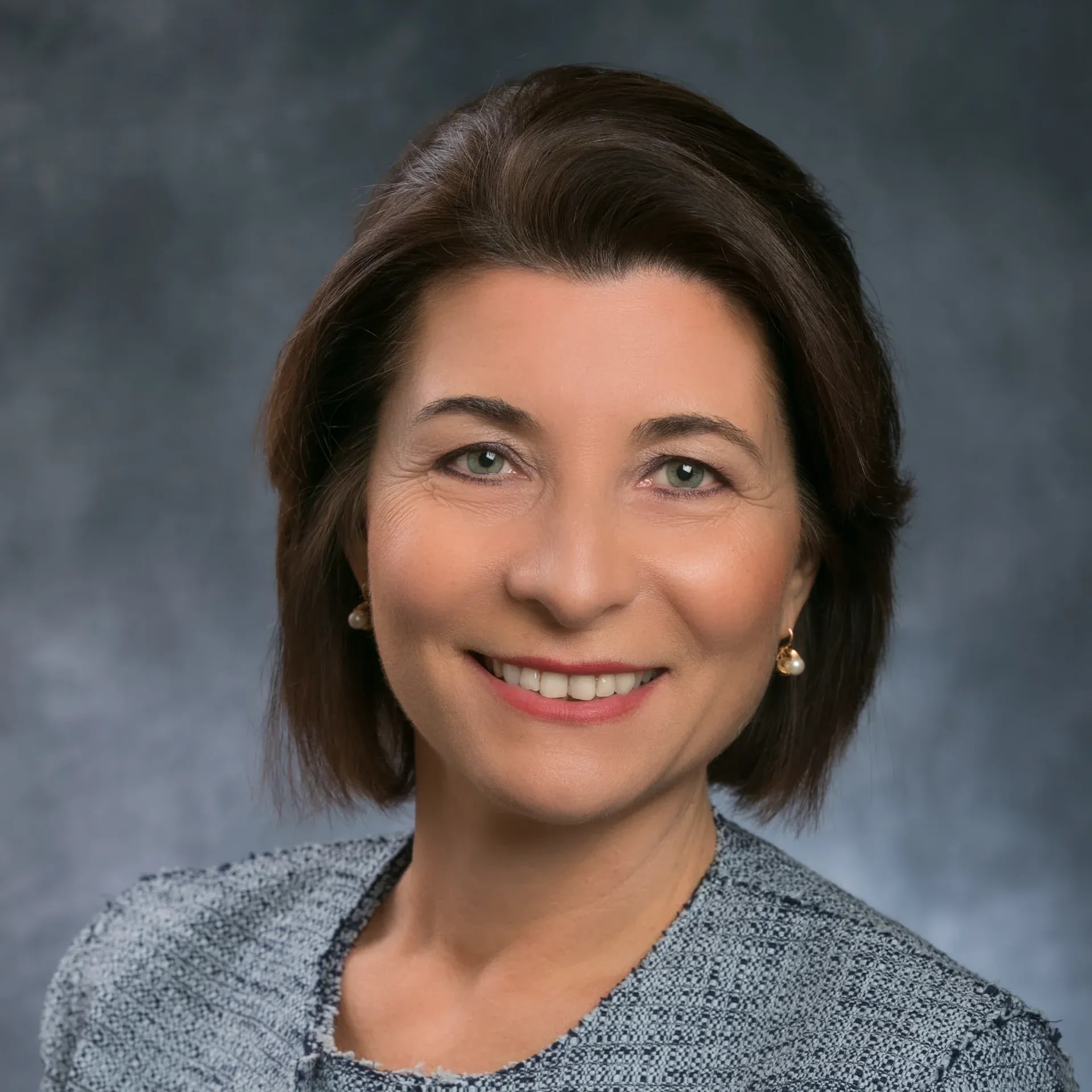 Smiling woman in professional studio headshot