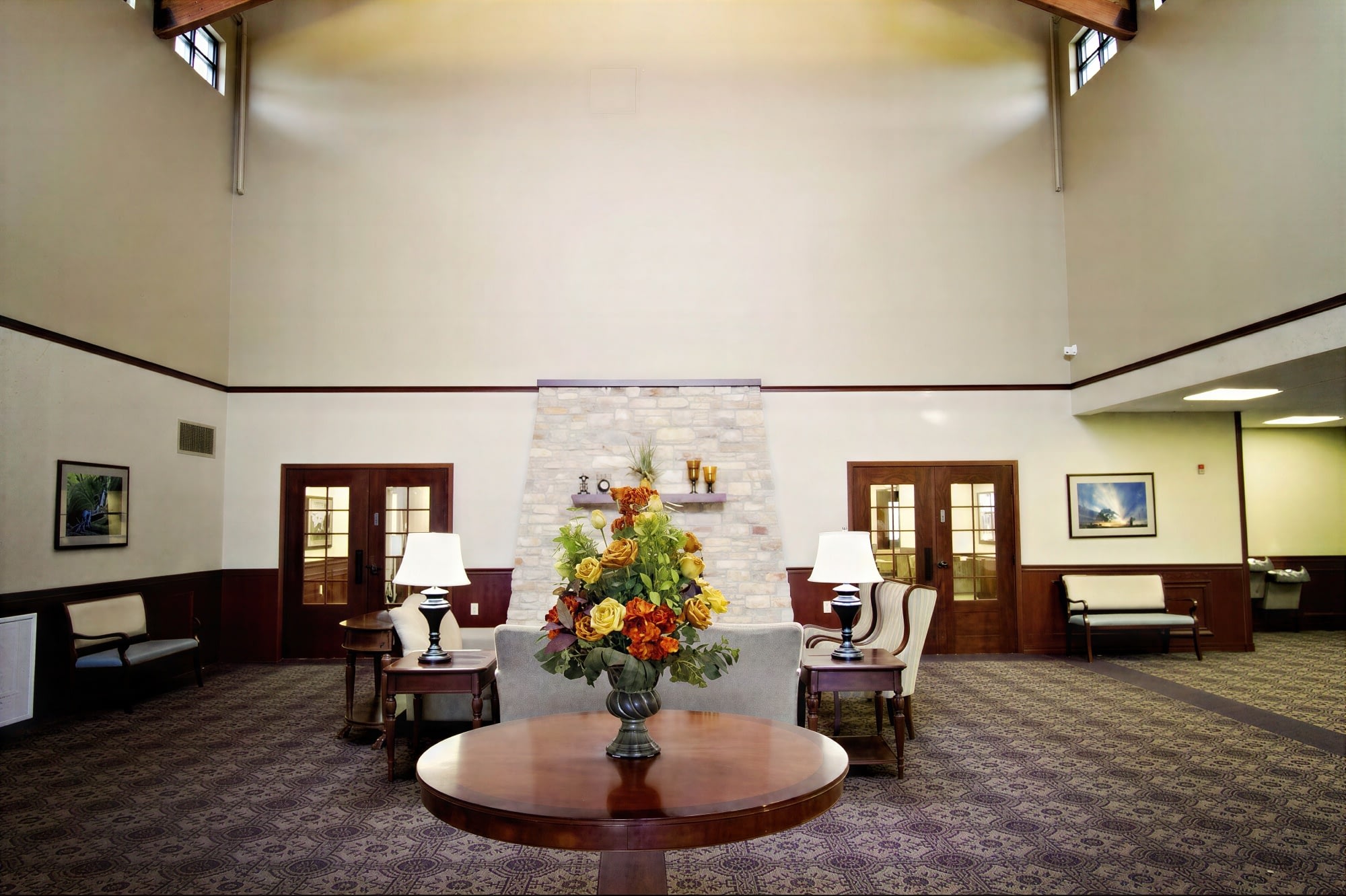Spacious lobby with fireplace and floral centerpiece