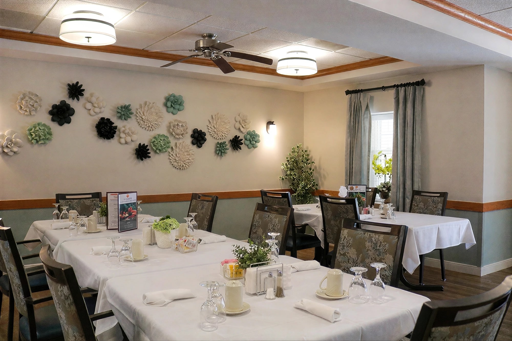 Elegant dining room with white tablecloth tables