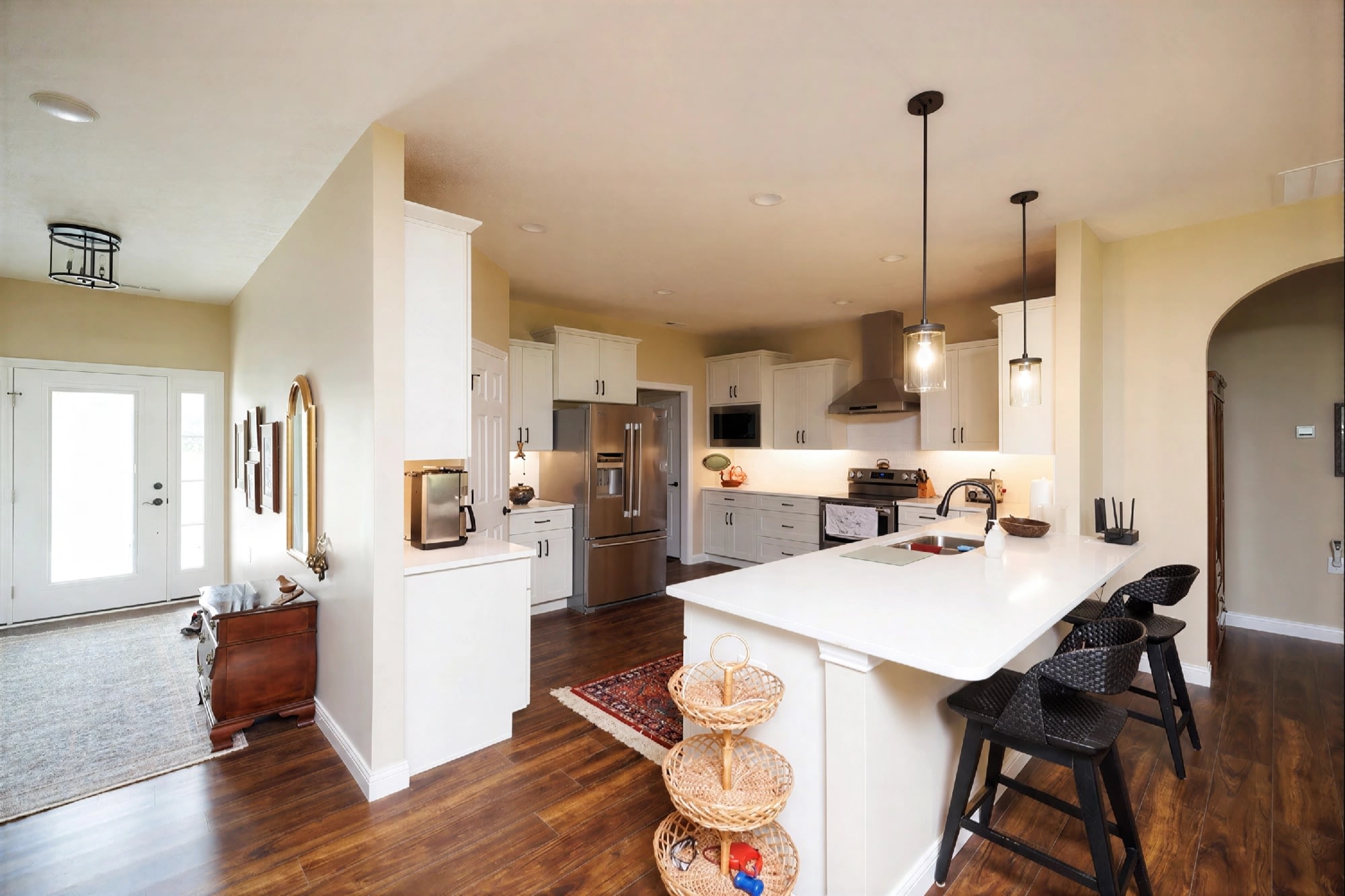 Modern white kitchen with island and bar stools