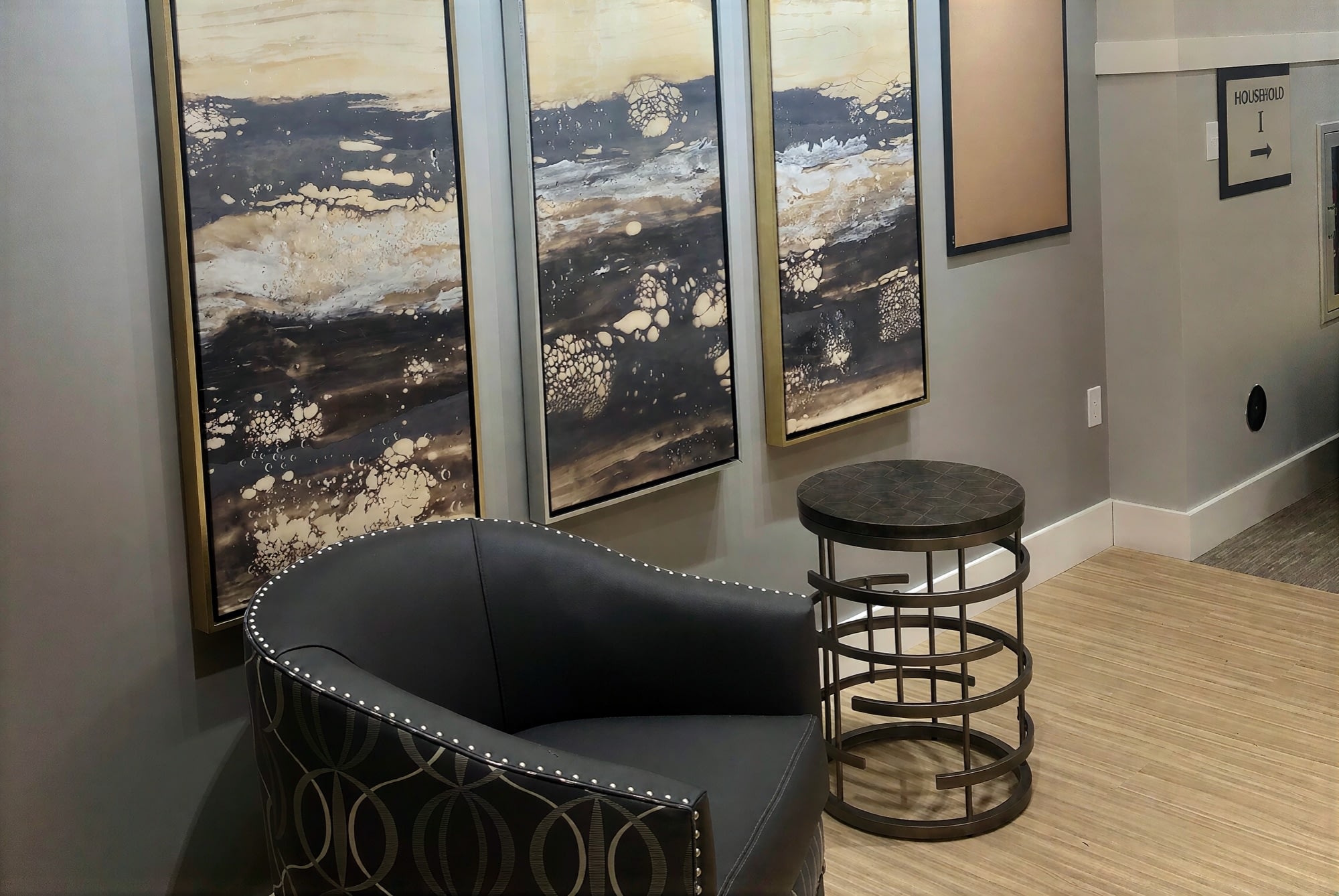 Modern hallway with abstract wall art and chair