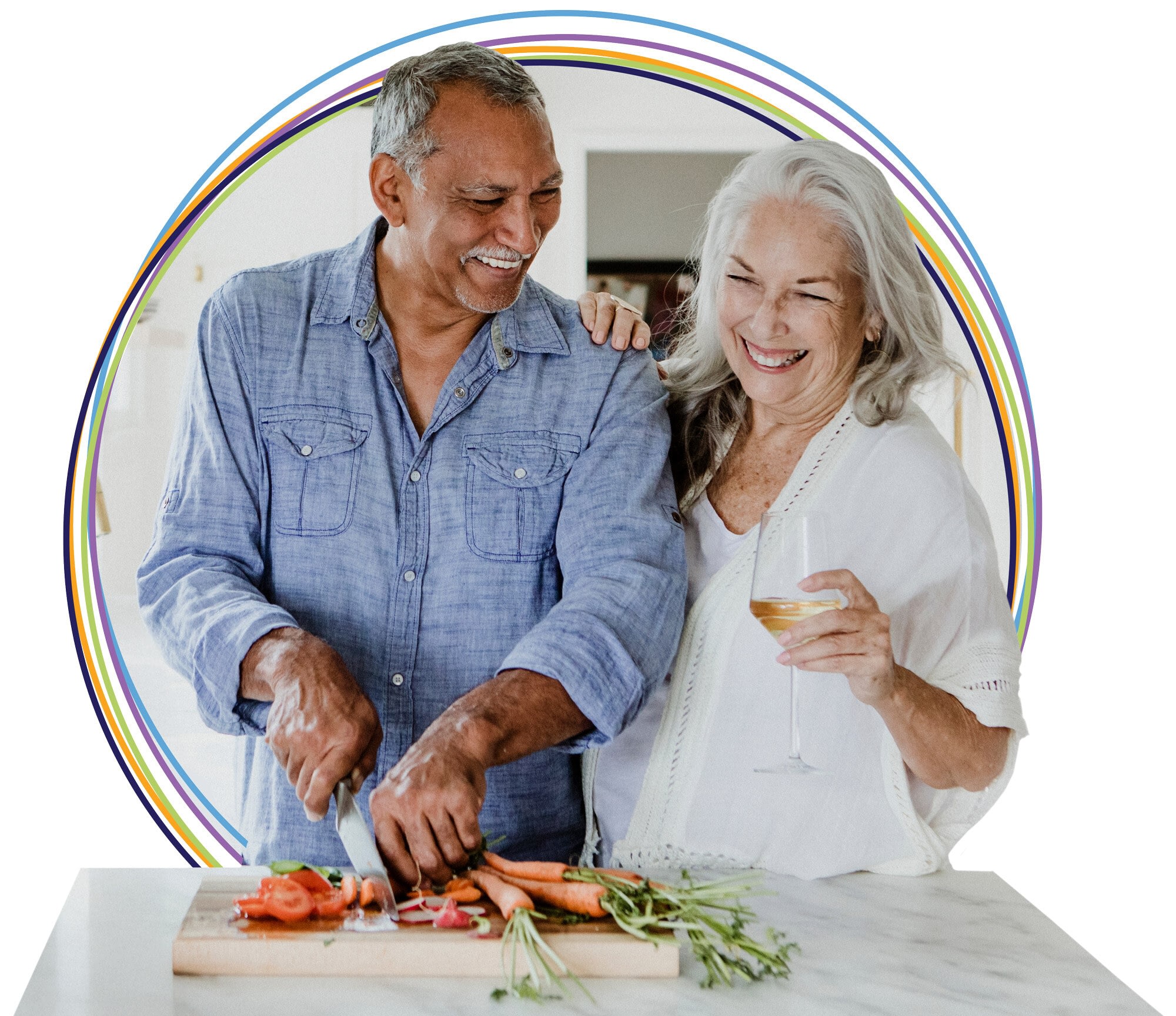 Smiling older couple cooking together in kitchen