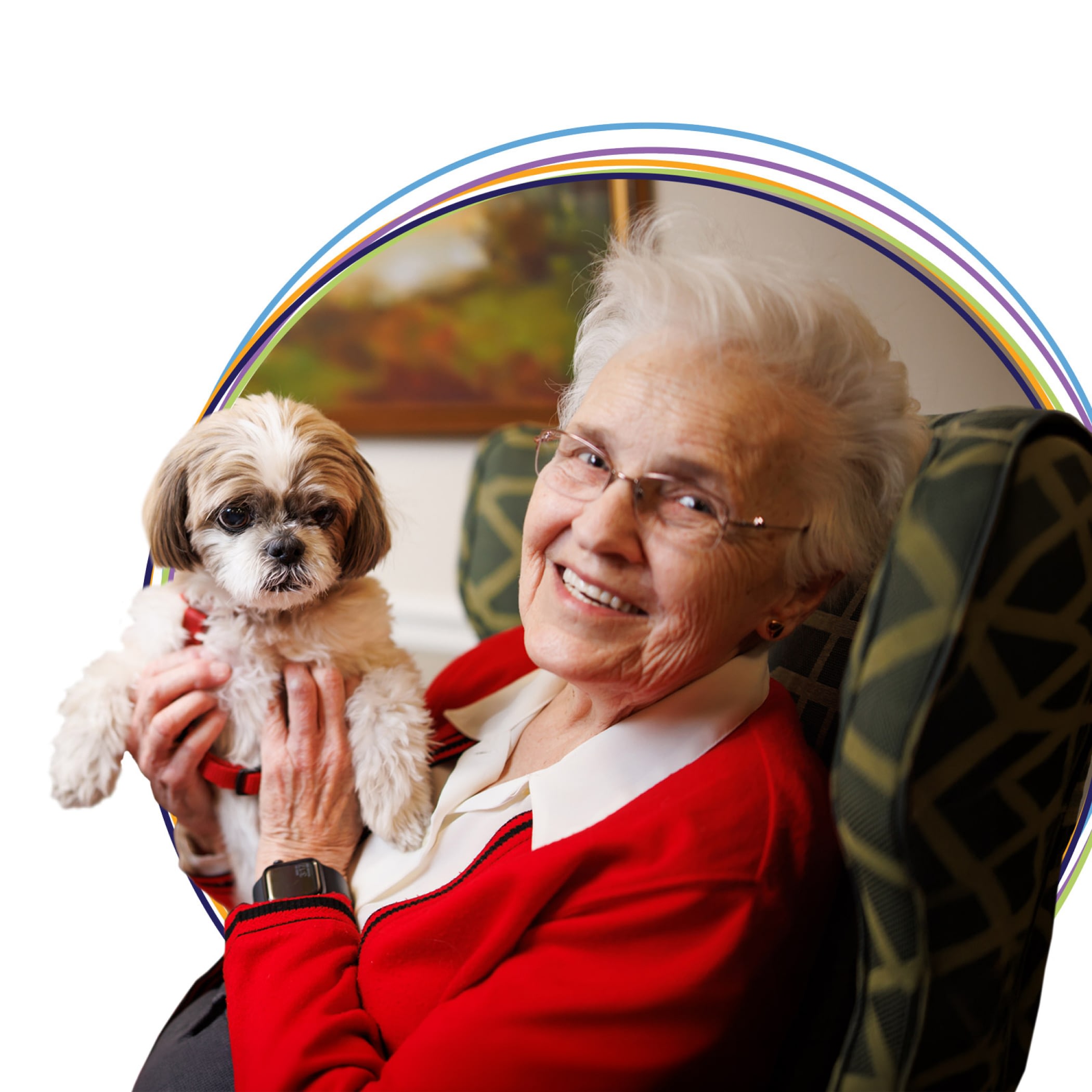 Smiling elderly woman holding small dog indoors