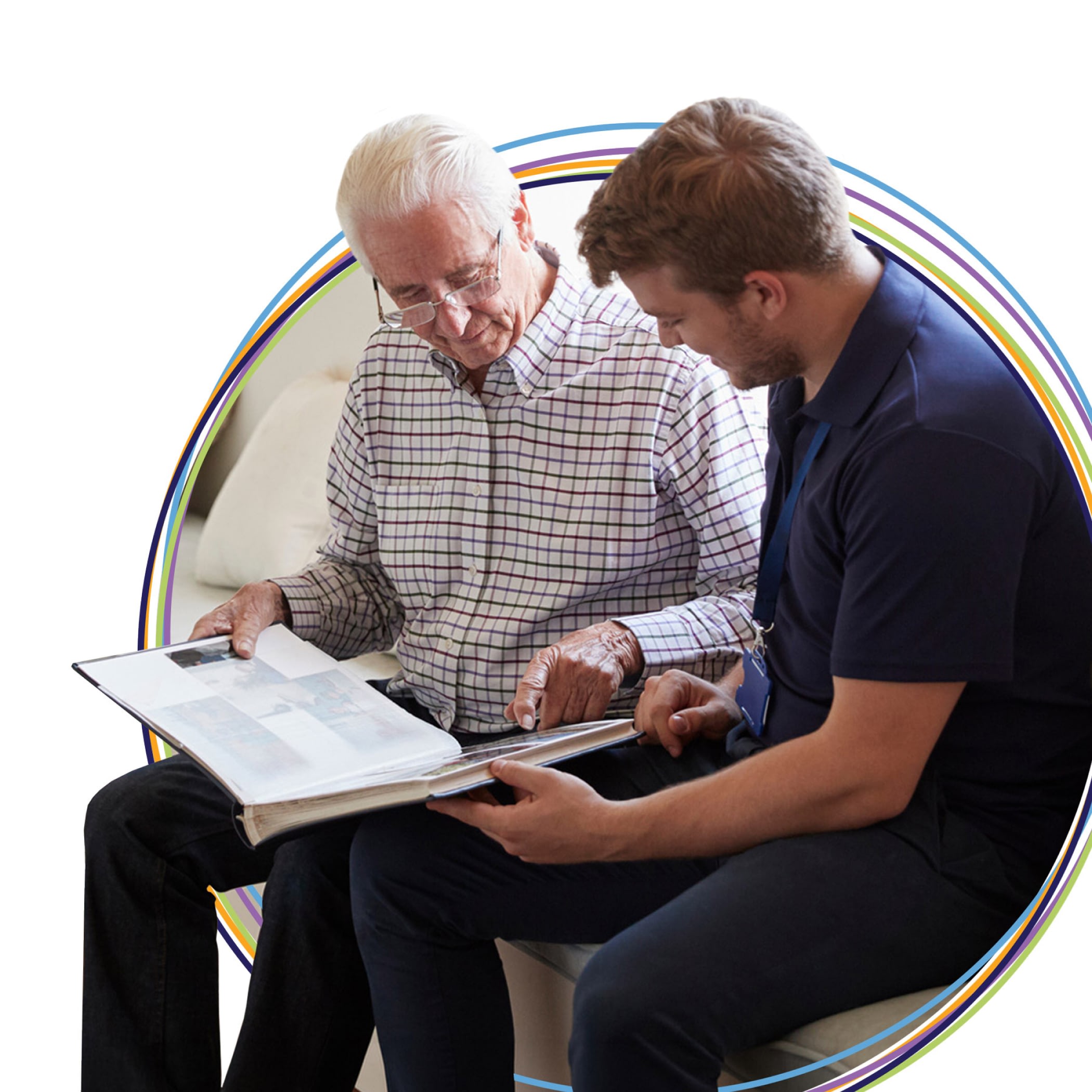 Senior man and caregiver looking at photo album