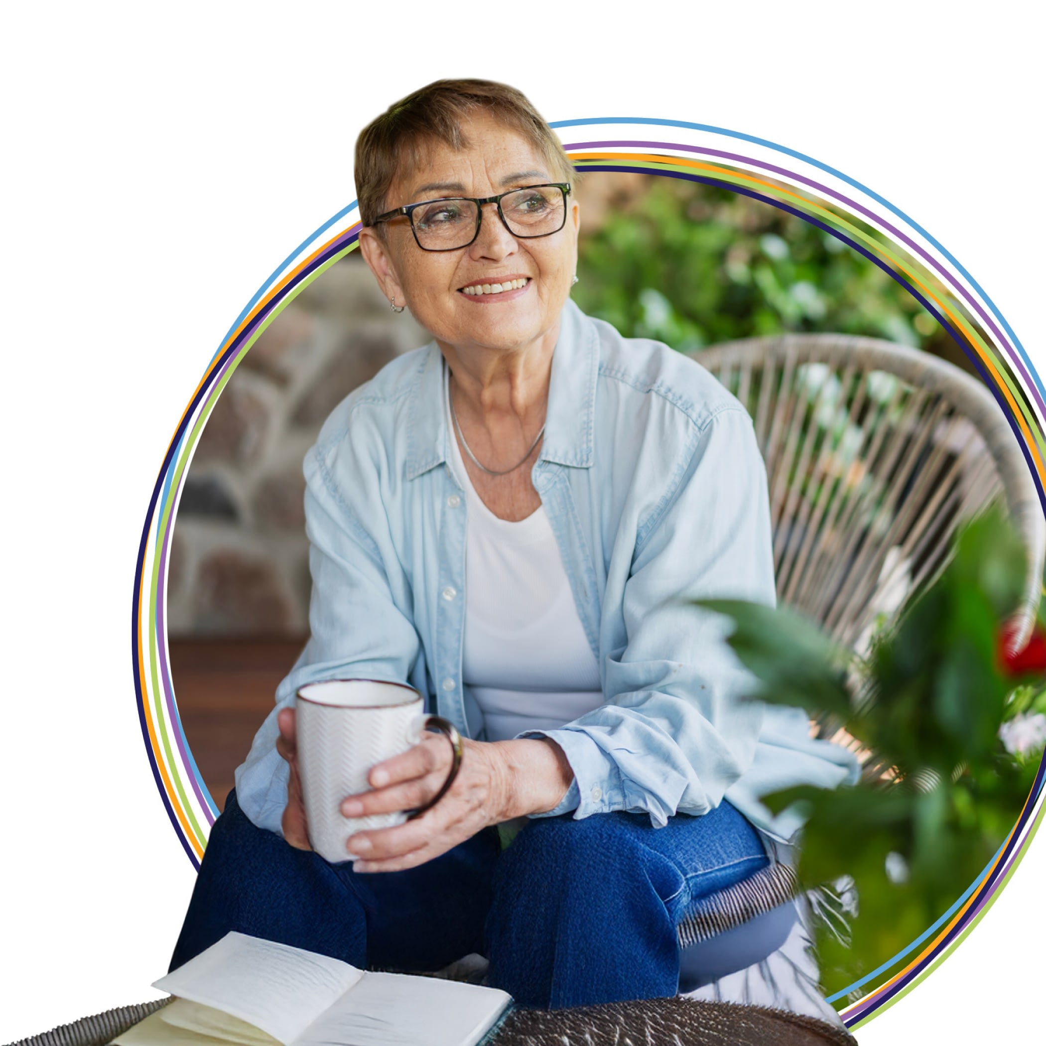 Smiling older woman holding mug with open book