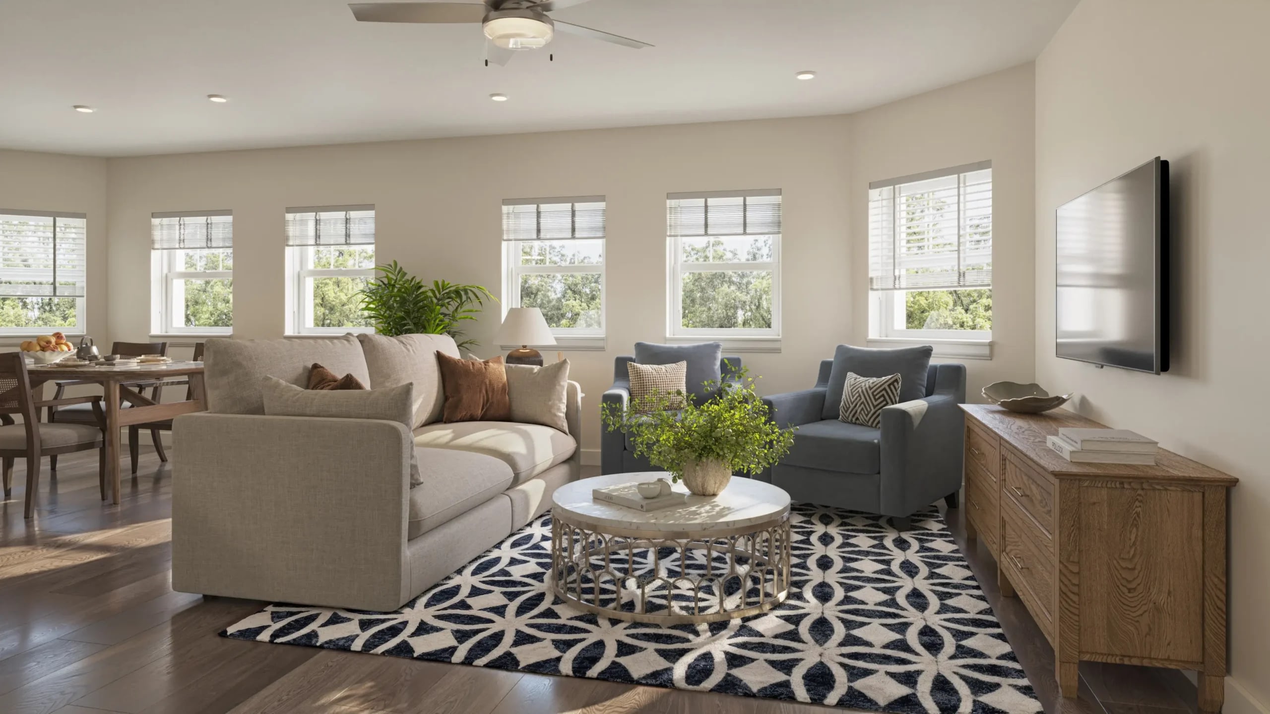 Bright modern living room with sofa and armchairs