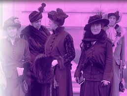 Women in early 1900s attire posing outdoors