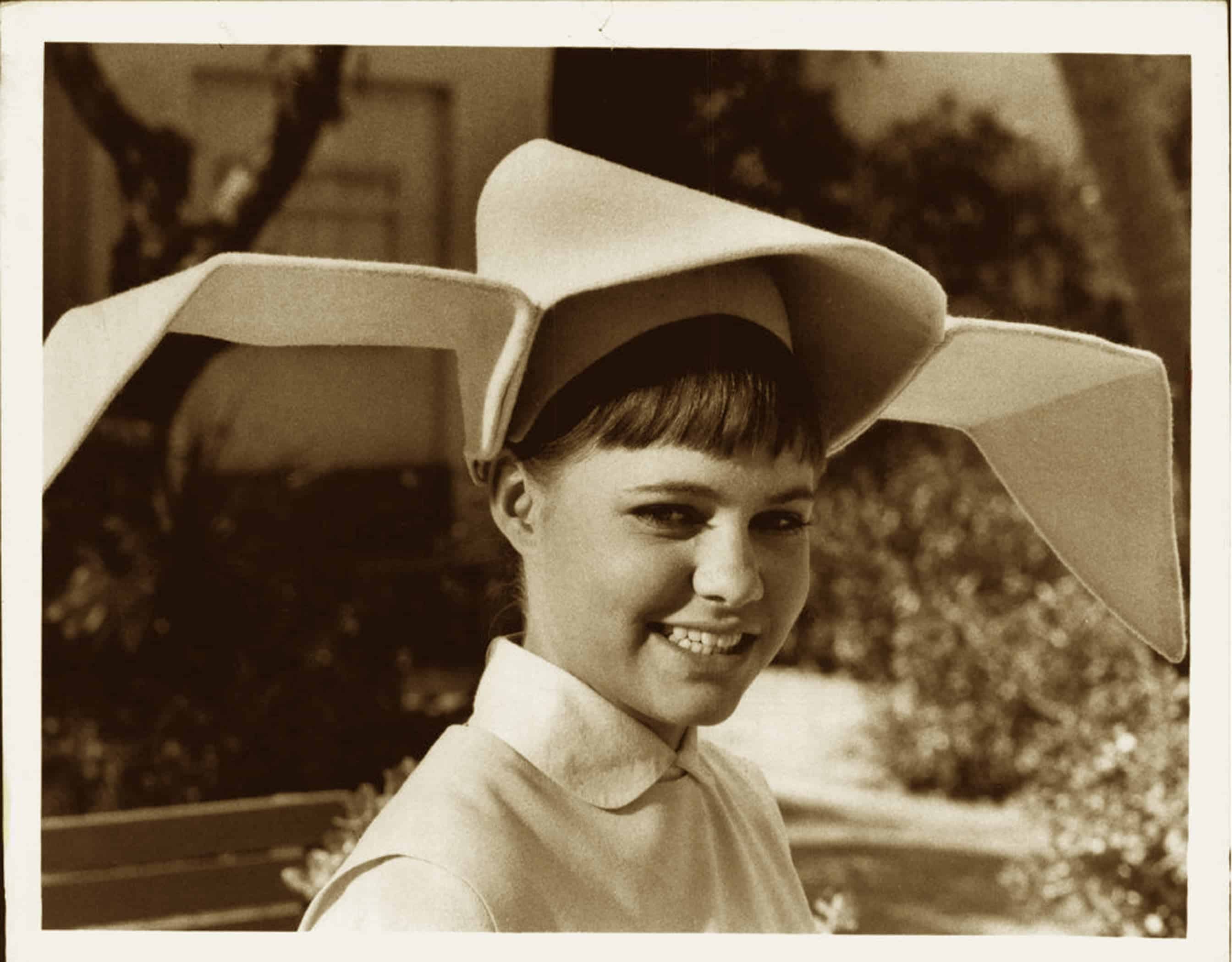 Sepia portrait of woman wearing dramatic wide-brim hat