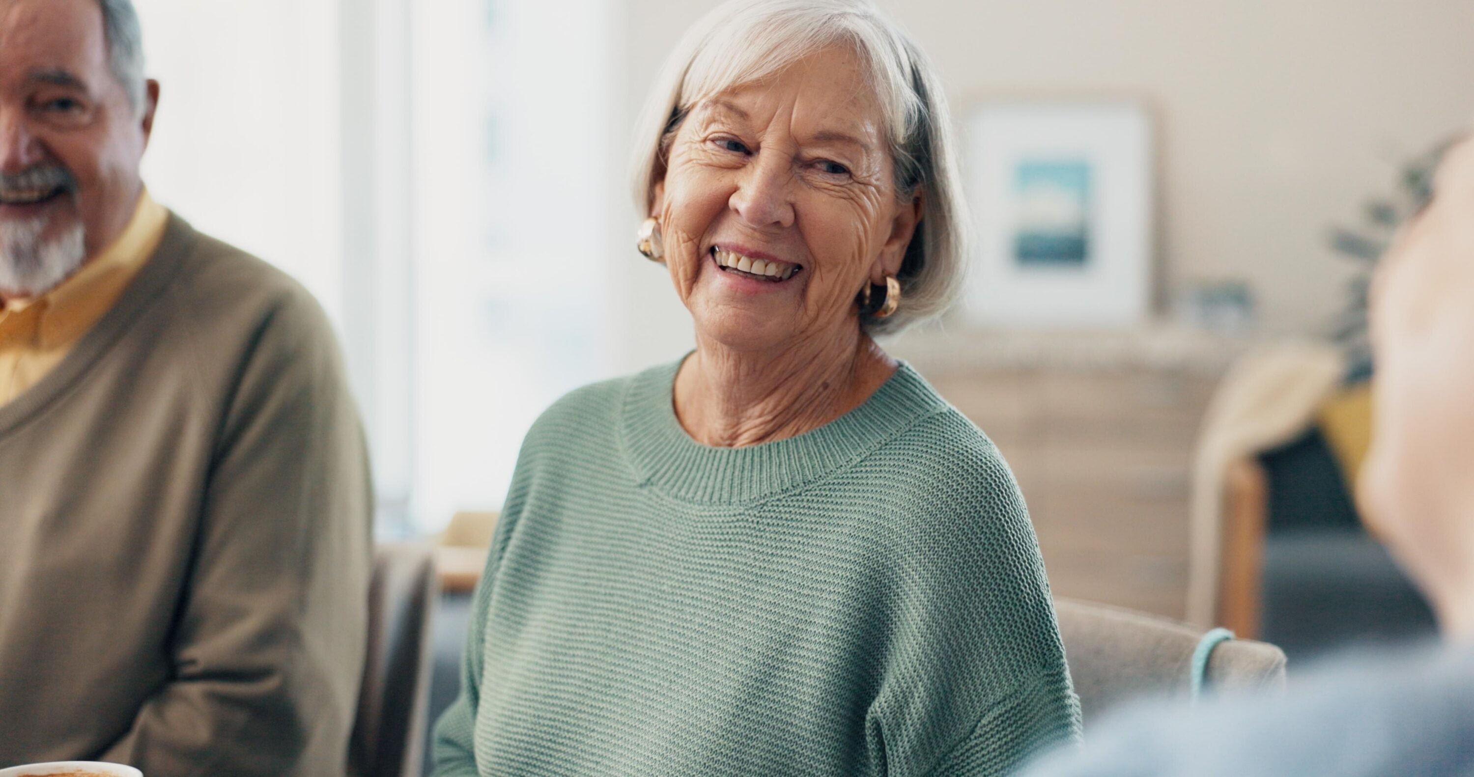 Smiling elderly woman in cozy home setting