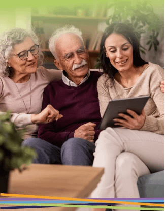 Elderly couple and young woman using tablet together