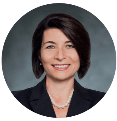Professional headshot of smiling woman in blazer
