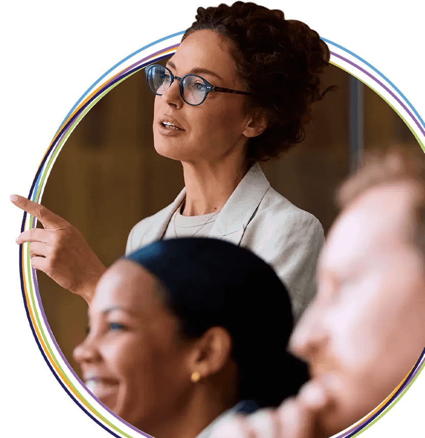 Woman presenting and pointing during team meeting