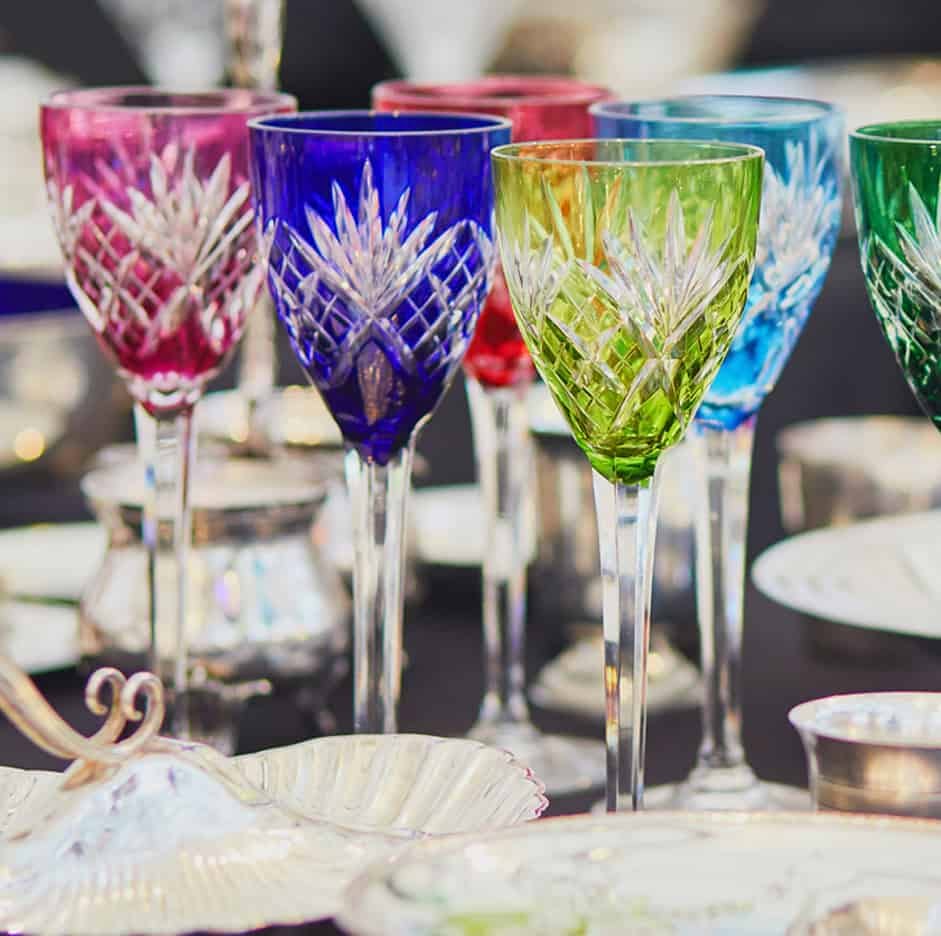 Colorful cut crystal wine glasses on table