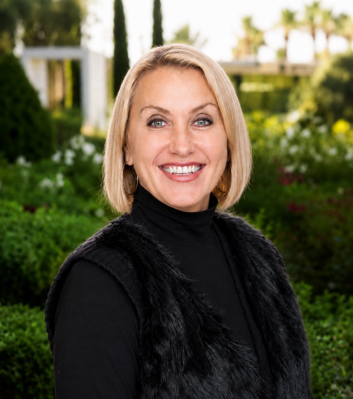 Smiling woman in garden setting outdoors
