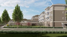Modern apartment complex with landscaped courtyard and trees