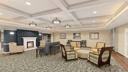 Elegant lounge with fireplace and coffered ceiling