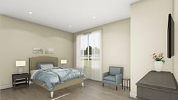 Modern bedroom with blue bedding and armchair