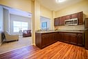 Modern kitchen with dark wood cabinets and granite counters