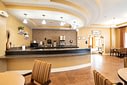 Hotel breakfast area with curved granite counter