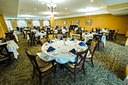 Elegant banquet hall with round tables set