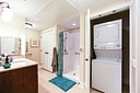 Accessible bathroom with roll-in shower and washer dryer
