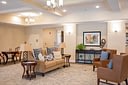 Cozy beige living room with leather chairs
