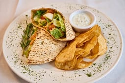 Pita wrap with chips and creamy dip