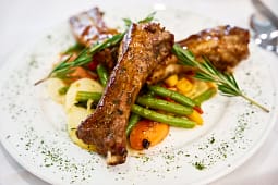 Roasted lamb shanks with vegetables and rosemary