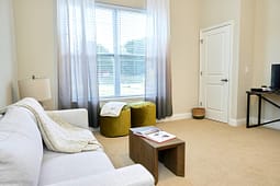 Bright living room with sofa and window