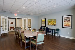 Bright meeting room with wooden table and chairs