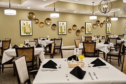 Elegant restaurant dining room with neatly set tables