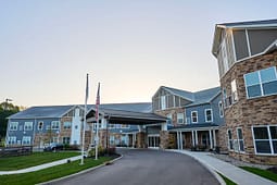 Modern senior living facility with covered entrance