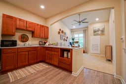 Modern kitchen with wood cabinets and island