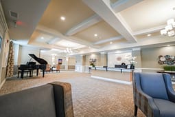 Elegant lobby with grand piano and reception desk